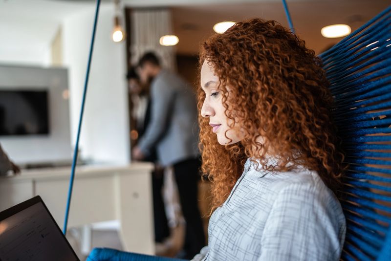 Young woman using the laptop at the office