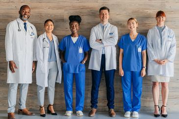 Group of diverse medical professionals standing together.