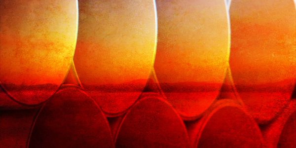 Stacked cylindrical pipes with a warm, textured gradient overlay.
