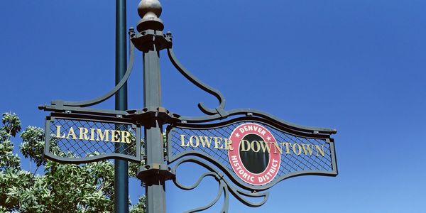 An antique-style street sign for Denver's Larimer Square