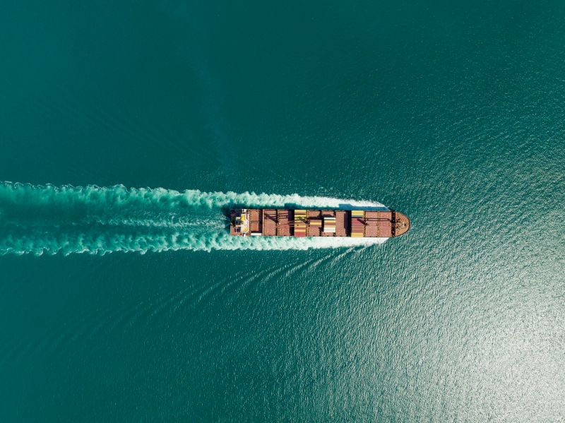 Cargo ship in import export and business logistic, Logistic and transportation of International Container Cargo ship in the open sea, Aerial shot from drone.