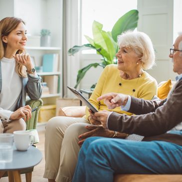 Senior living advisor meeting with an older couple.