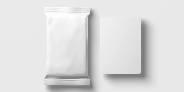 Blank packaging and card on a white surface.