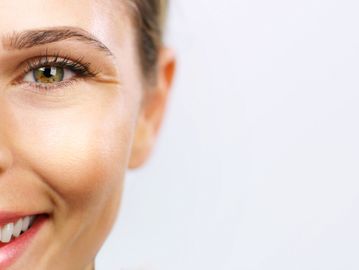 Woman's glowing skin treated with a high frequency treatment in Everett, WA at Autumn Noel Esthetics