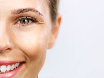 Woman's glowing skin treated with a high frequency treatment in Everett, WA at Autumn Noel Esthetics