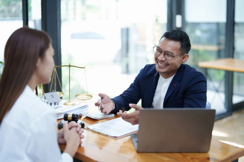 Portrait of a male lawyer with a smiling face advising clients on legal matters to fight a lawsuit against a defendant in court.