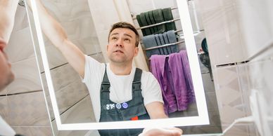 Installing a backlit bathroom mirror in Everett, Wa.