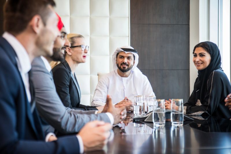 Multicultural business people meeting and talking about business - Multiracial business team meeting in Dubai