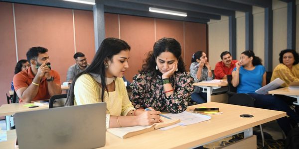 Students studying together in a classroom.