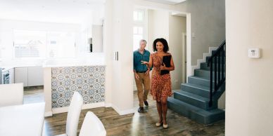 Couple touring a modern home interior.