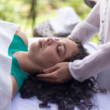 Woman receiving a relaxing head massage.