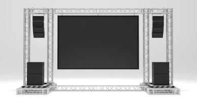 A large stage screen with speakers.