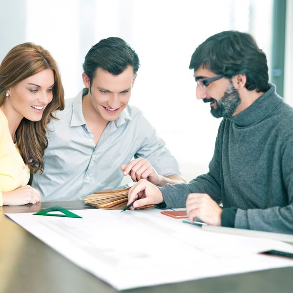 A man Drawing Salaam and a woman looking at him
