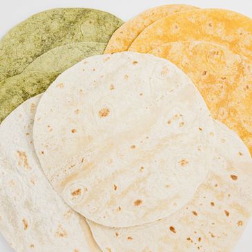 Soft corn and flour tortillas, perfect for tacos, wraps, and authentic Latin-inspired dishes.