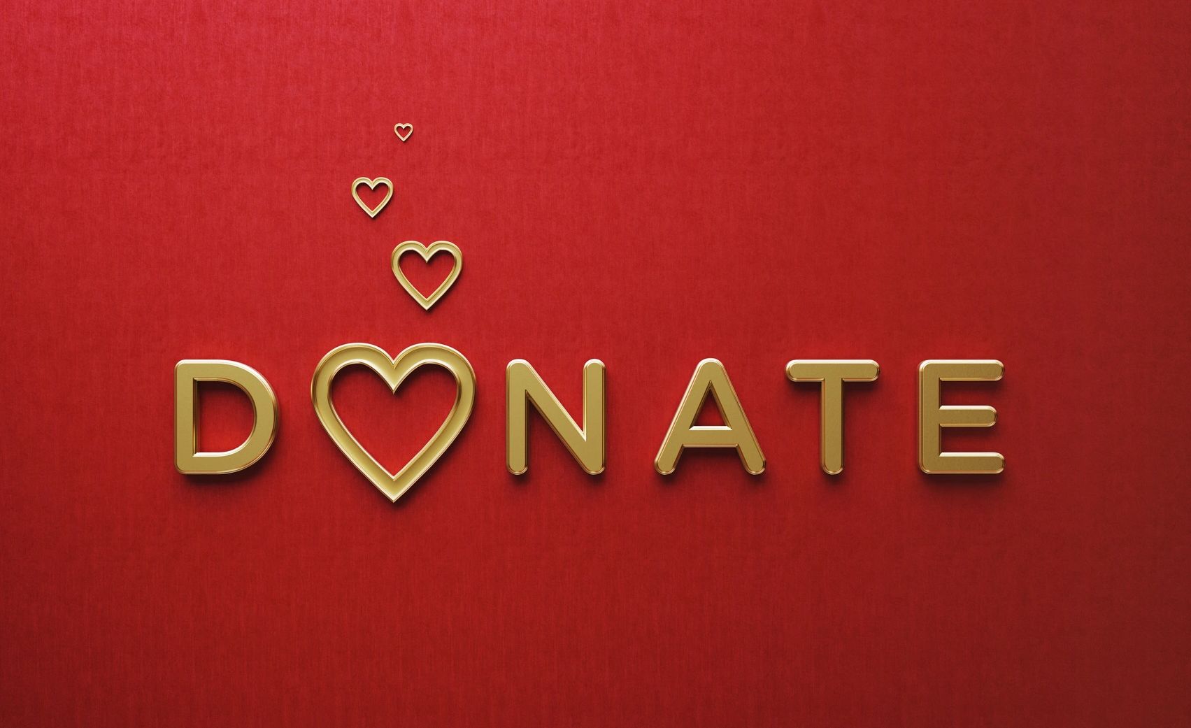 Golden letters spelling 'DONATE' with heart shapes on a red background.