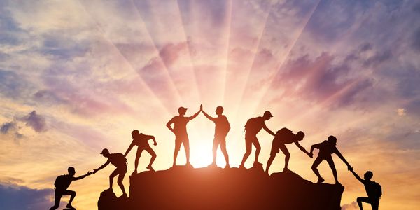 A photo showing team work among individuals