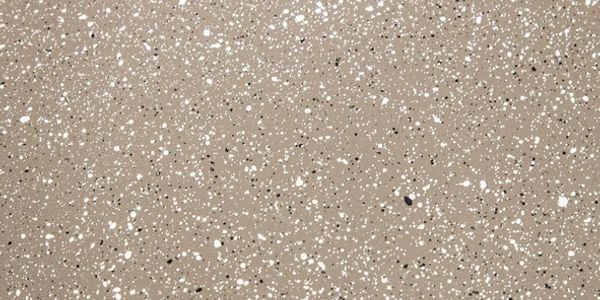 Beige surface with scattered white and black speckles.