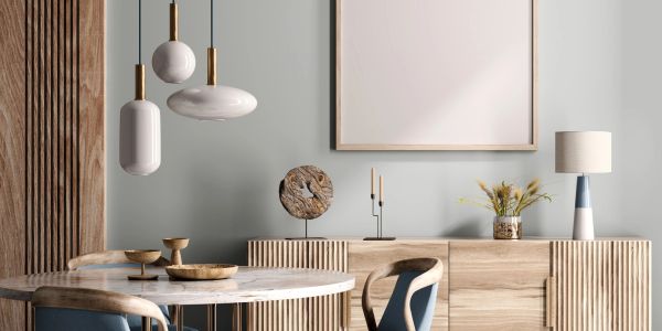 Modern dining room with wooden furniture and pendant lights.