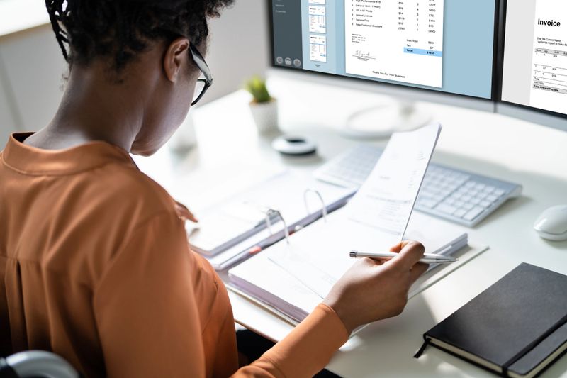 Professional African American Business Woman Doing Invoice Audit