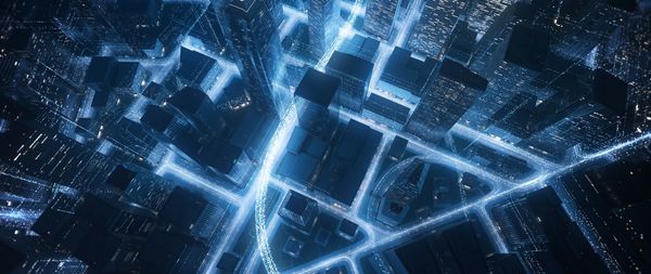 A futuristic cityscape illuminated with glowing blue light trails.