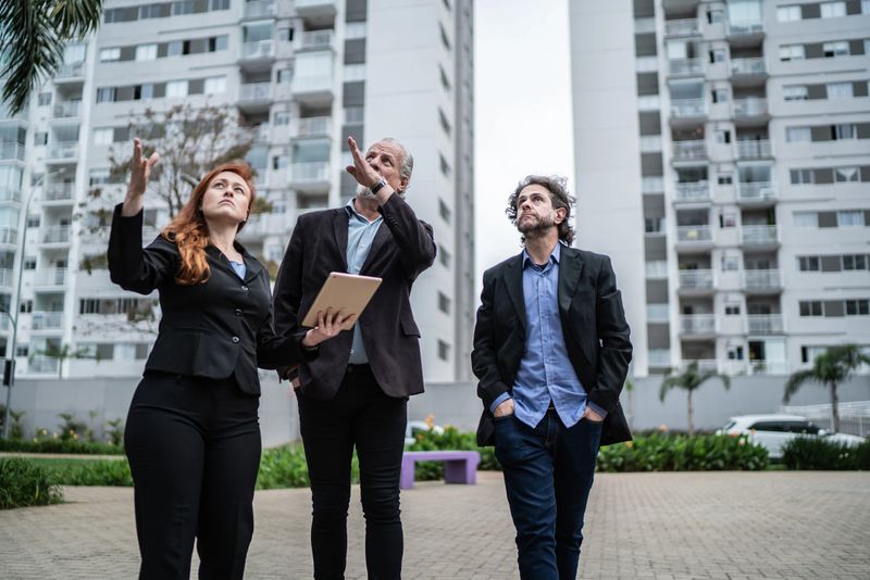 Real estate people doing a meeting in the street