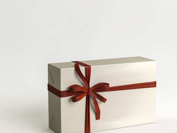 Elegant cream gift box with a shiny red ribbon bow.