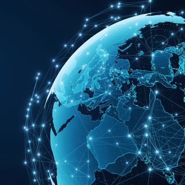 Digital globe showing Europe, Asia, and Africa connected by glowing network lines.