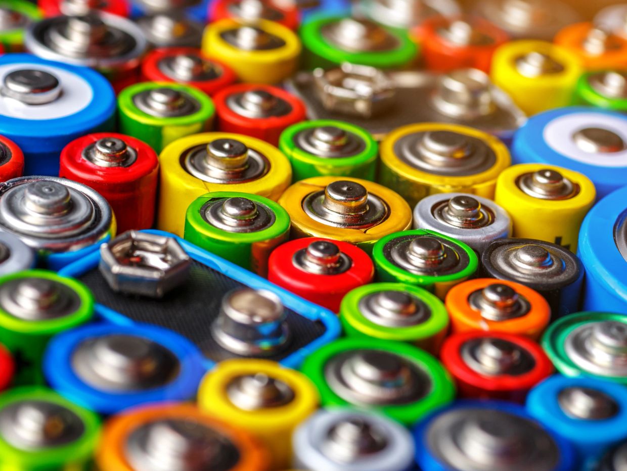 Close-up of colorful assorted batteries arranged together.