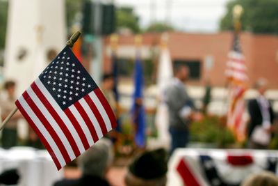 American flag waving at a patriotic outdoor event.