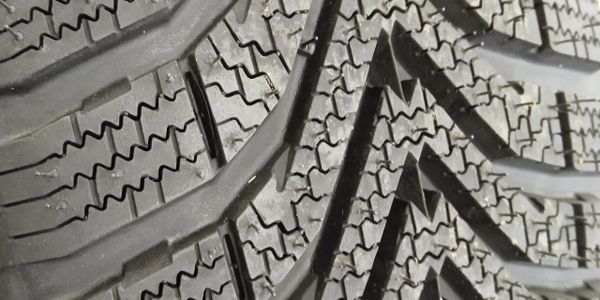 Close-up of a tire tread with intricate patterns.
