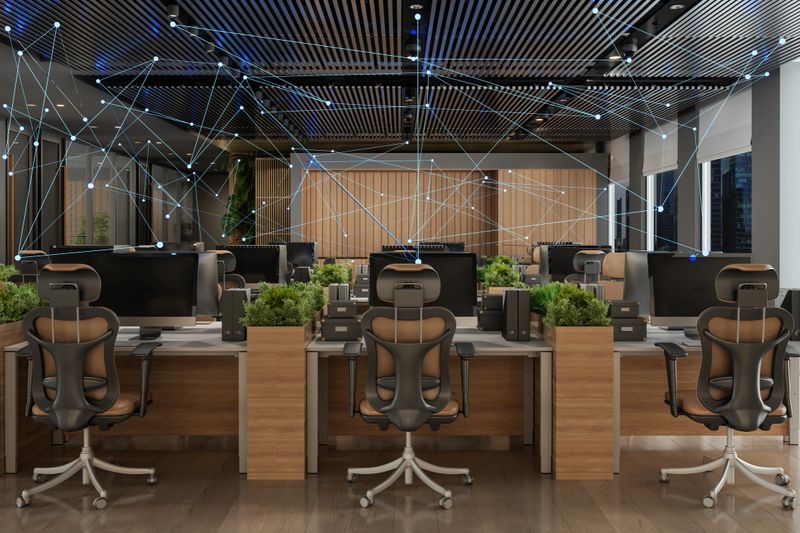 Smart Office Concept. Modern Open Plan Office Interior With Tables, Office Chairs, Computers and Plexus. Control With Mobile App And Technology Devices.