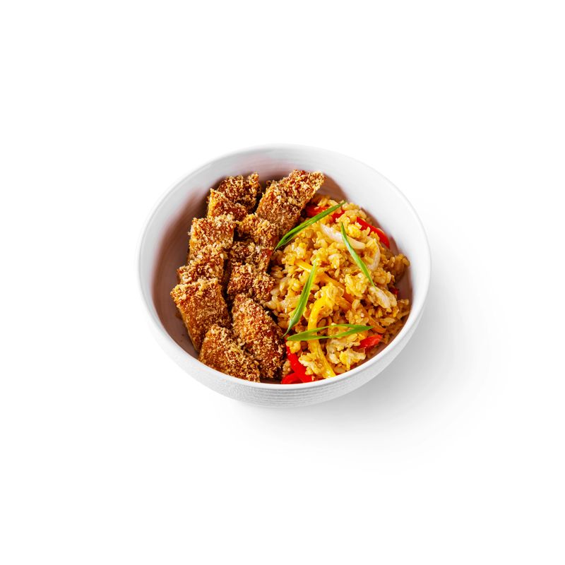 Rice with peppers, onions and meat in breading in a plate on a white background