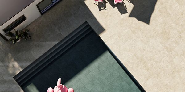 Modern outdoor pool area with flamingo float and lounge chairs.