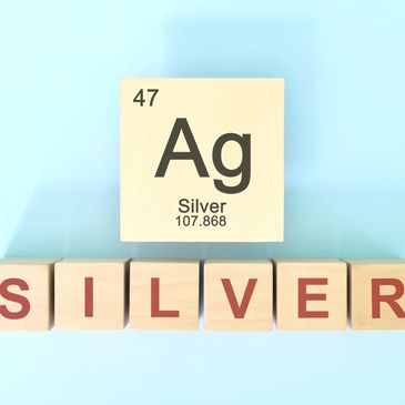 Wooden blocks spelling Silver with a Silver element block on top.