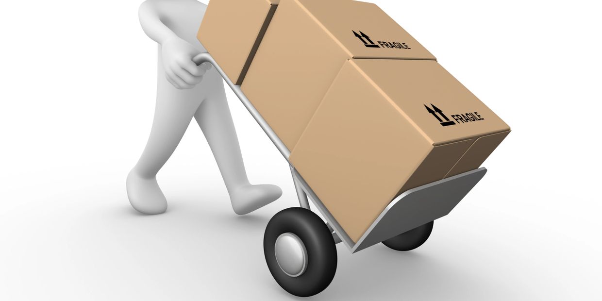 3D figure pushing a hand truck with fragile boxes.