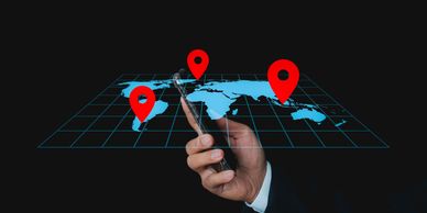 A phone pinpointed on a map, revealing the user’s movements and real-time location trail, silently.