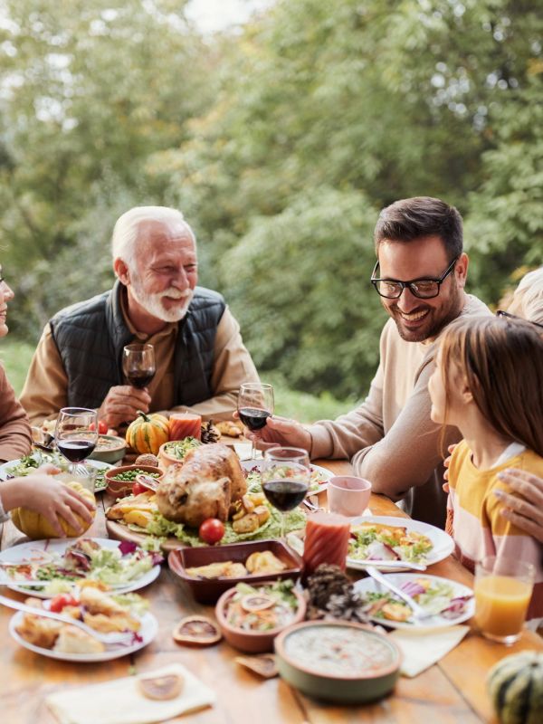 Family enjoying a festive outdoor meal together.
