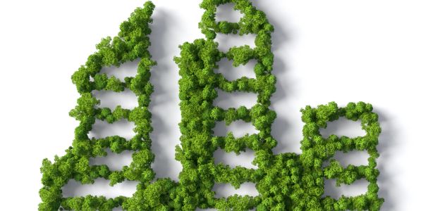Green trees shaped like city buildings representing eco-friendly urban design.