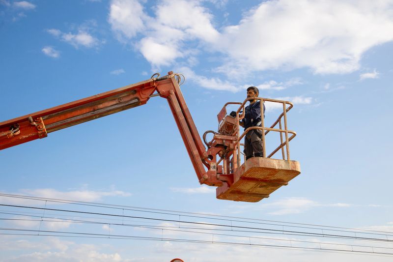 A low angle shot of a man working at a construction site - concept of construction