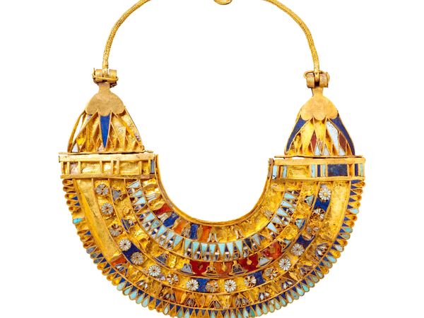 Ancient gold and enamel necklace with intricate designs and clasp.