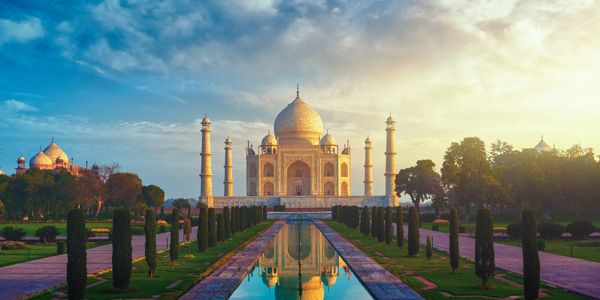 The Taj Mahal is an ivory-white marble mausoleum on the bank of the river Yamuna in Agra, India.
