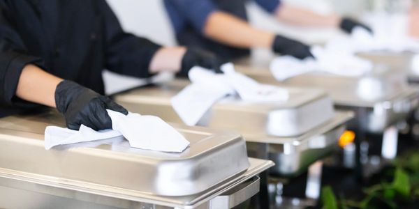 Servers ready to serve portion control for buffet dinner