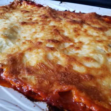 Close-up of cheesy baked lasagna.