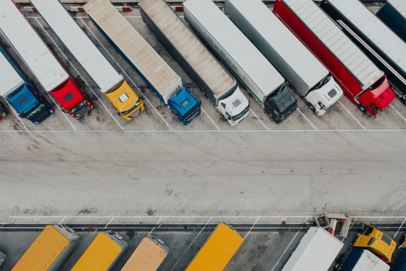 Aerial shot of trucks parked at truck stop