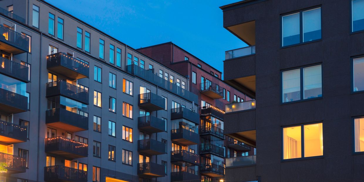 Modern apartment building exterior at dusk