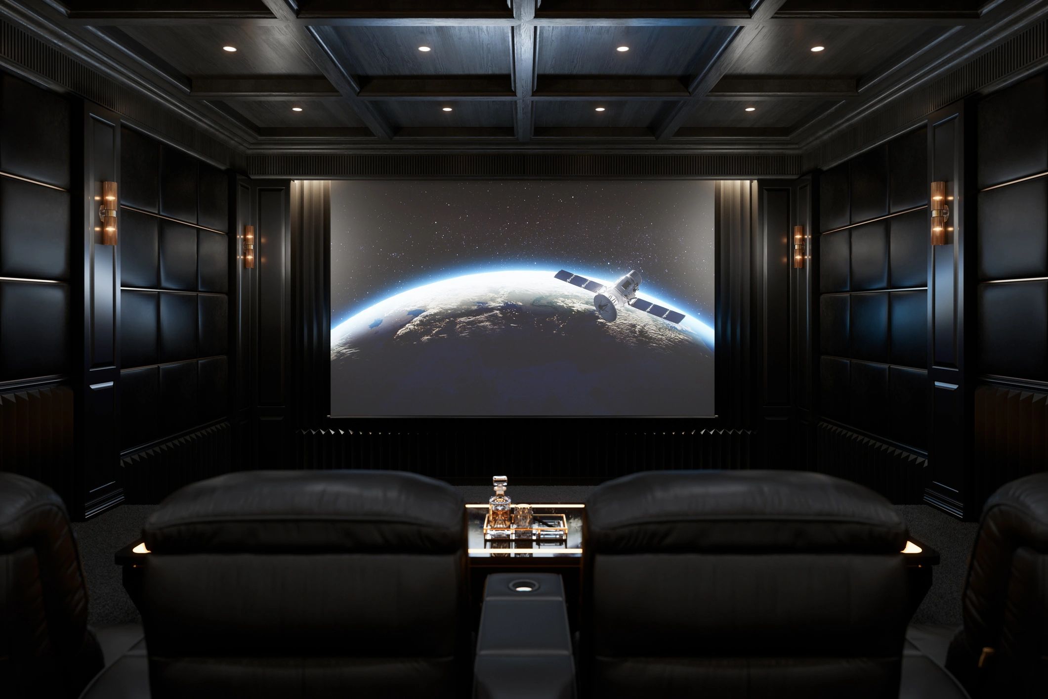 Luxurious home theater with black leather seating and space-themed screen.