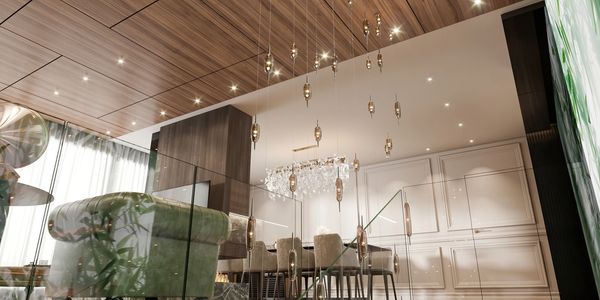 Modern dining room with elegant lighting and wooden ceiling.