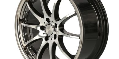 Black and silver car wheel rim with multi-spokes and bolts.