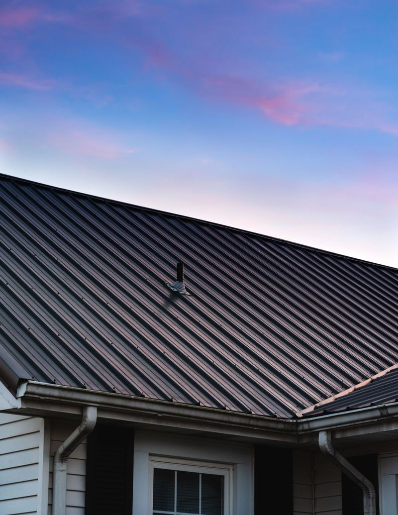 A vertical shot of a beautiful house metal roof during the sunset