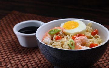 Fiery seafood ramen with fresh toppings.
